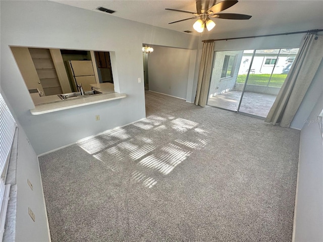 13102 Pembrook Ct, Hudson, FL 34667 - carpeted empty room with a ceiling fan and a sink