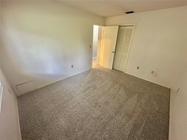 13102 Pembrook Ct, Hudson, FL 34667 - unfurnished bedroom featuring carpet flooring and a closet