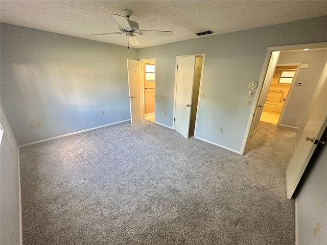 13102 Pembrook Ct, Hudson, FL 34667 - unfurnished bedroom with carpet floors, a textured ceiling, and a ceiling fan