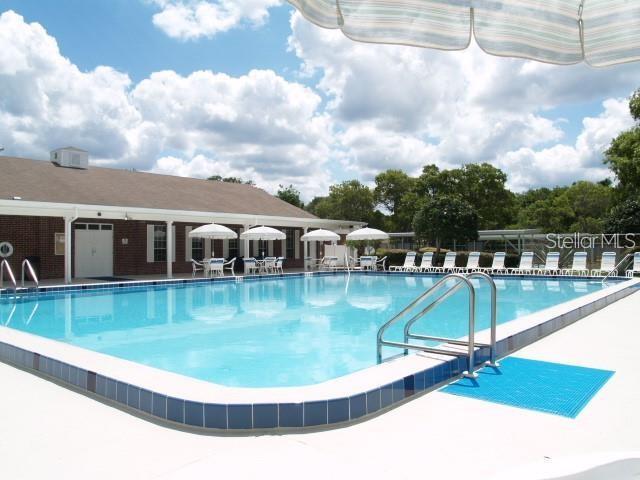 13102 Pembrook Ct, Hudson, FL 34667 - community pool with a patio area