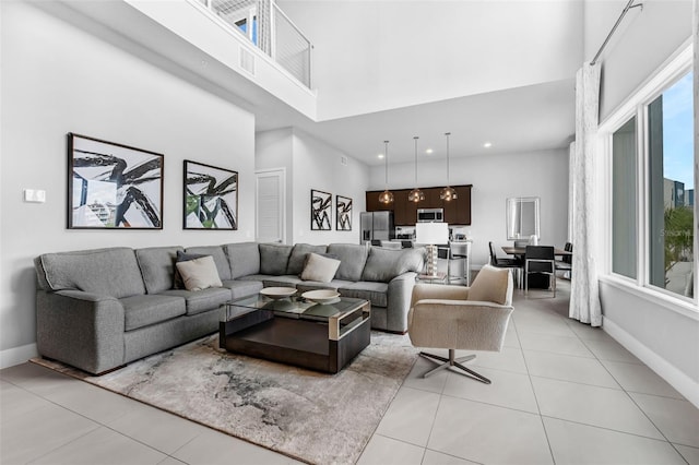 7740 Sandy Ridge Dr Unit 235, Reunion, FL 34747 - living area with a high ceiling, light tile patterned floors, and recessed lighting