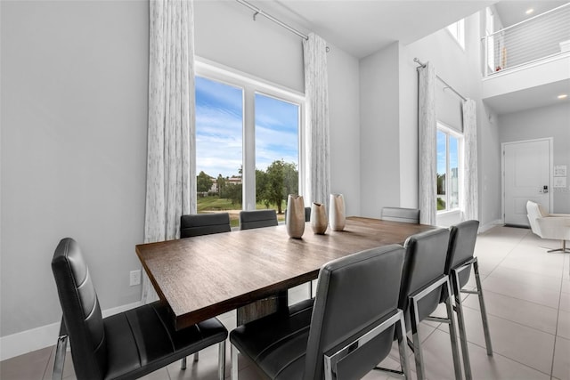 7740 Sandy Ridge Dr Unit 235, Reunion, FL 34747 - dining area featuring light tile patterned floors and a high ceiling