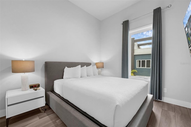 7740 Sandy Ridge Dr Unit 235, Reunion, FL 34747 - bedroom featuring wood finished floors and baseboards