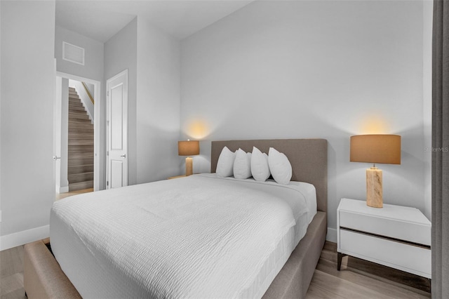 7740 Sandy Ridge Dr Unit 235, Reunion, FL 34747 - bedroom with baseboards and wood finished floors