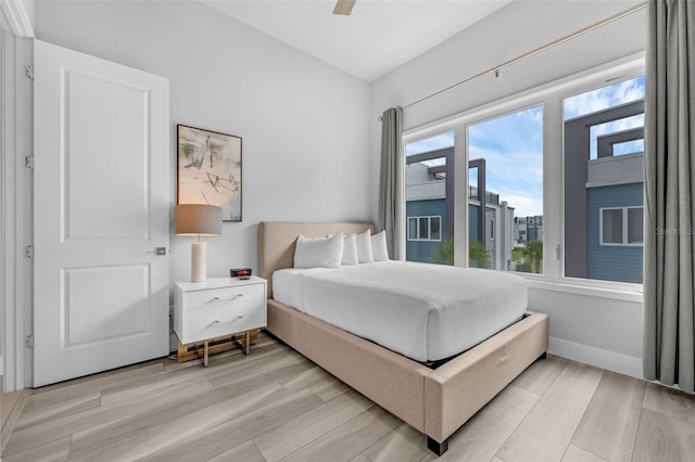 7740 Sandy Ridge Dr Unit 235, Reunion, FL 34747 - bedroom featuring light wood finished floors and ceiling fan