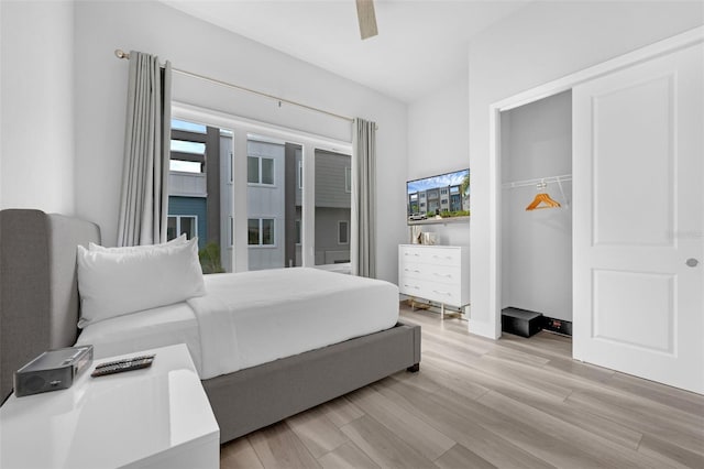 7740 Sandy Ridge Dr Unit 235, Reunion, FL 34747 - bedroom with light wood finished floors and ceiling fan