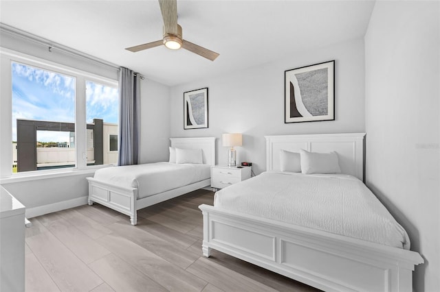 7740 Sandy Ridge Dr Unit 235, Reunion, FL 34747 - bedroom featuring light wood-type flooring and ceiling fan