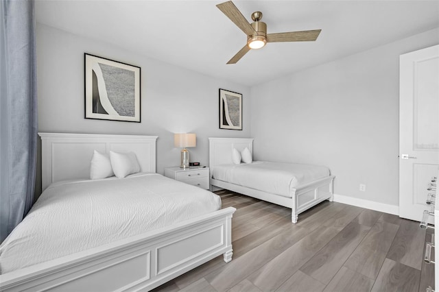 7740 Sandy Ridge Dr Unit 235, Reunion, FL 34747 - bedroom with wood finished floors and a ceiling fan