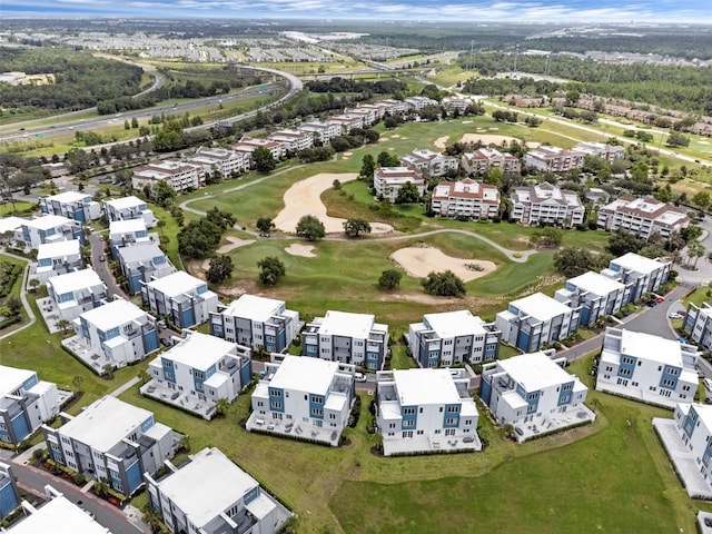 7740 Sandy Ridge Dr Unit 235, Reunion, FL 34747 - aerial perspective of suburban area with a local golf course