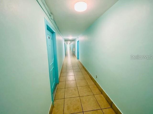 221 Columbia Dr Unit 342, Cape Canaveral, FL 32920 - hallway featuring light tile patterned floors and baseboards