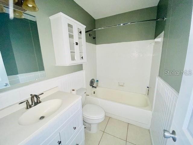 221 Columbia Dr Unit 342, Cape Canaveral, FL 32920 - full bath with a wainscoted wall, vanity, tub / shower combination, and tile patterned flooring
