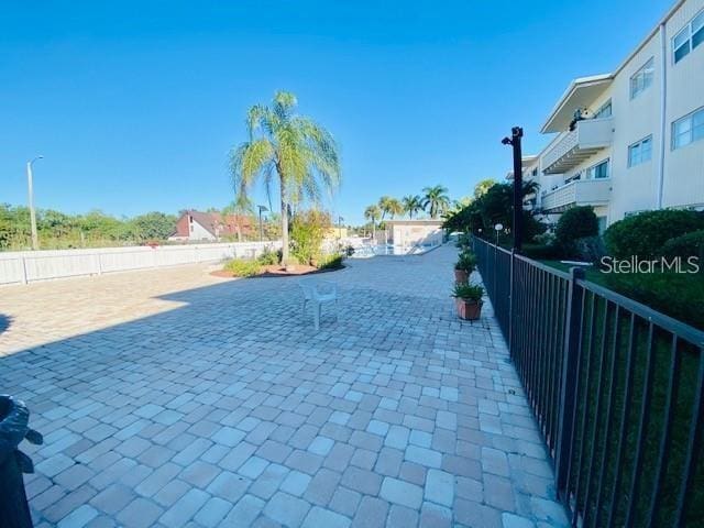 221 Columbia Dr Unit 342, Cape Canaveral, FL 32920 - view of decorative driveway featuring street lighting