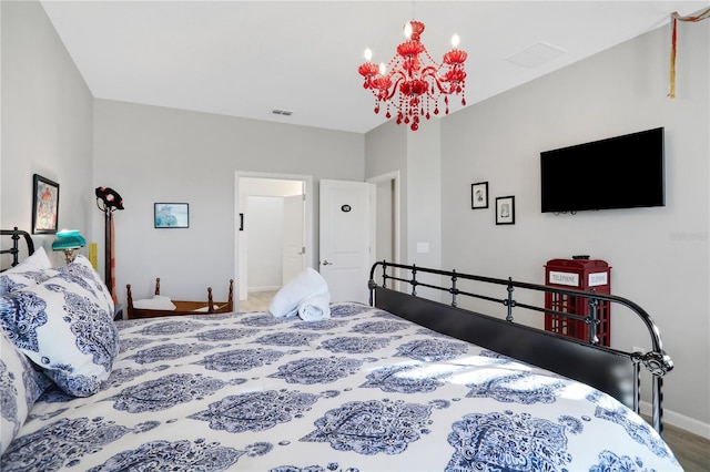 2541 Shanti Dr, Kissimmee, FL 34746 - bedroom with a chandelier and baseboards