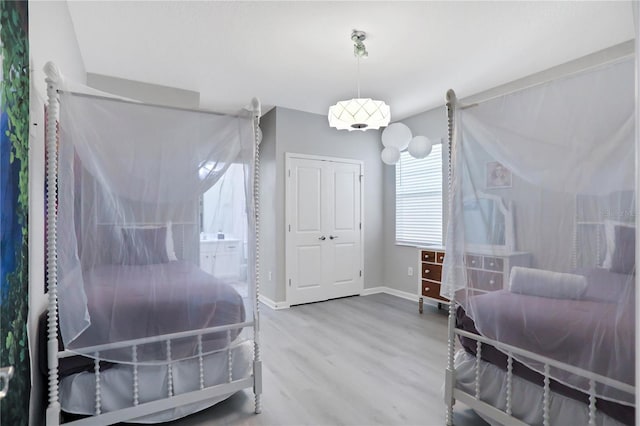 2541 Shanti Dr, Kissimmee, FL 34746 - bedroom with wood finished floors and a closet