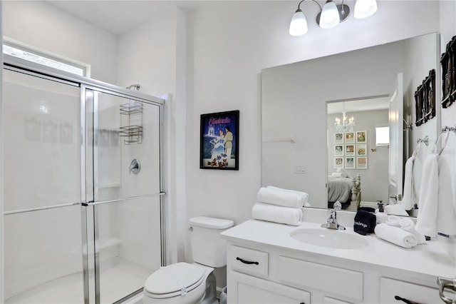 2541 Shanti Dr, Kissimmee, FL 34746 - bathroom with connected bathroom, a chandelier, a stall shower, vanity, and plenty of natural light