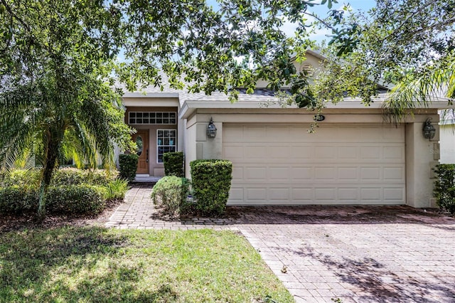 123 Preston Ave, Davenport, FL 33837 - view of front of property featuring decorative driveway and stucco siding