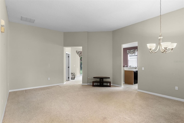 123 Preston Ave, Davenport, FL 33837 - unfurnished room with a chandelier and light colored carpet
