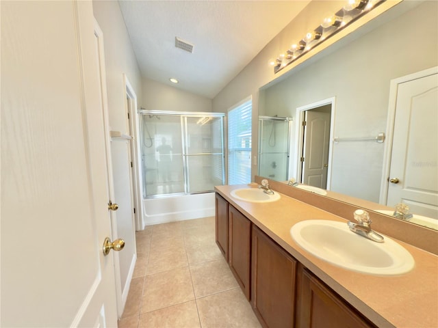 10238 Cala Lily Trl Unit S, Orlando, FL 32832 - full bath featuring tile patterned floors, double vanity, vaulted ceiling, and enclosed tub / shower combo