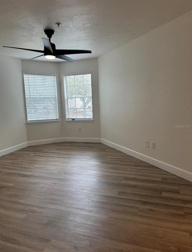 7280 Westpointe Blvd Unit 823, Orlando, FL 32835 - unfurnished room featuring a ceiling fan, a textured ceiling, and dark wood-style floors