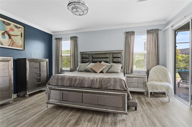2215 Camden Park Ave, Davenport, FL 33837 - bedroom with crown molding, wood finished floors, and access to exterior
