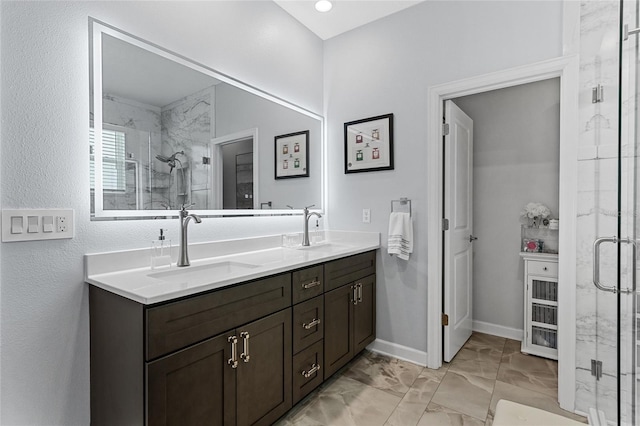 2215 Camden Park Ave, Davenport, FL 33837 - full bath featuring marble look tile flooring, a marble finish shower, and double vanity