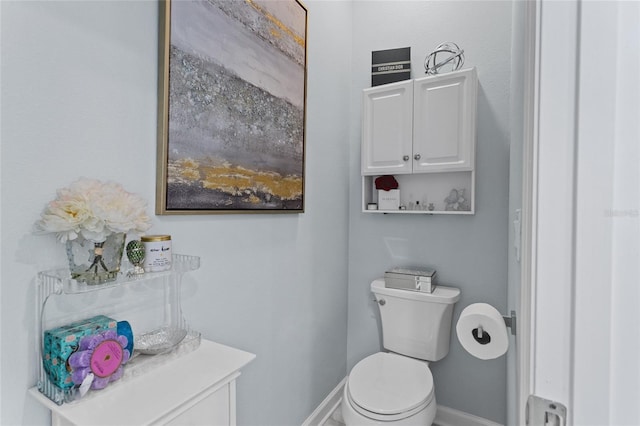 2215 Camden Park Ave, Davenport, FL 33837 - bathroom featuring baseboards and toilet