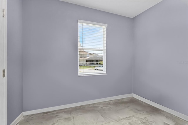 2215 Camden Park Ave, Davenport, FL 33837 - spare room with marble finish flooring and plenty of natural light