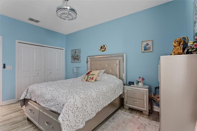 2215 Camden Park Ave, Davenport, FL 33837 - bedroom with light wood-style floors and a closet