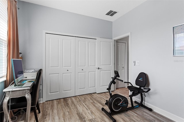 2215 Camden Park Ave, Davenport, FL 33837 - home office featuring light wood-type flooring and baseboards