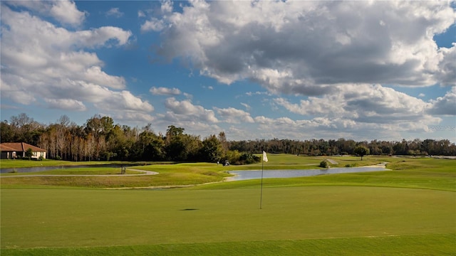 2215 Camden Park Ave, Davenport, FL 33837 - view of community with a water view, a yard, view of wooded area, and golf course view