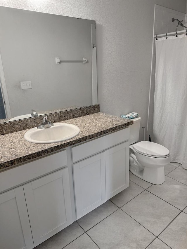 388 Rooks Loop, Haines City, FL 33844 - bathroom with vanity, tile patterned floors, and a shower with shower curtain