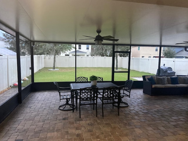 2618 San Simeon Way, Kissimmee, FL 34741 - sunroom / solarium featuring a ceiling fan, outdoor dining area, and healthy amount of natural light
