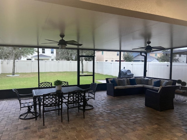 2618 San Simeon Way, Kissimmee, FL 34741 - sunroom / solarium with ceiling fan, an outdoor hangout area, outdoor dining area, and plenty of natural light