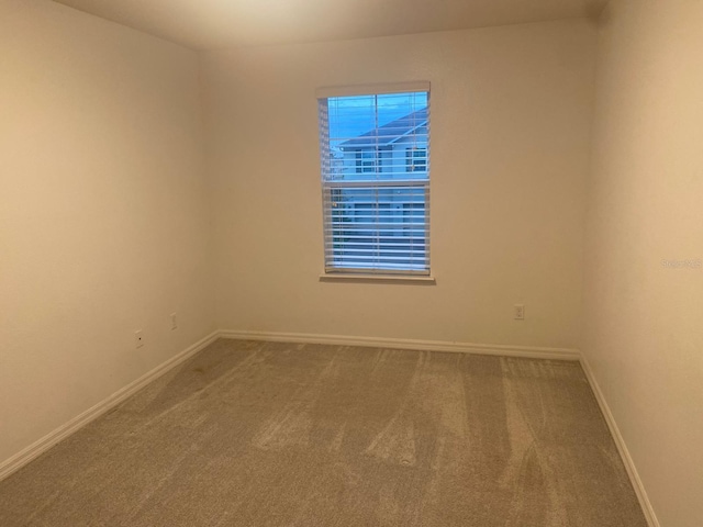 2618 San Simeon Way, Kissimmee, FL 34741 - carpeted empty room with baseboards