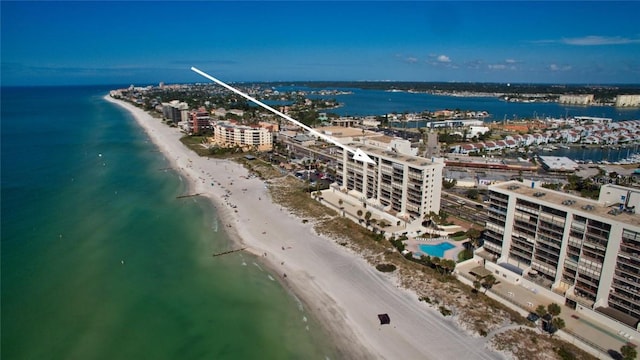 bird's eye view featuring a view of the beach and a water view