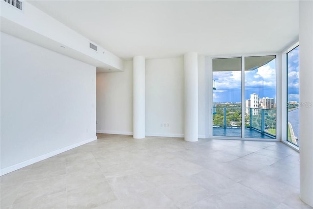 empty room featuring expansive windows