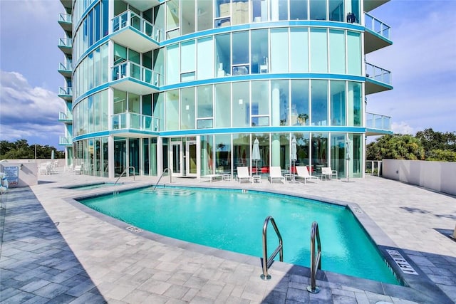 view of swimming pool with a patio area