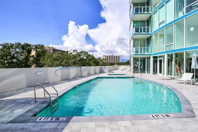 view of pool featuring a patio