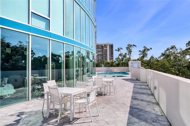 view of patio / terrace featuring a community pool