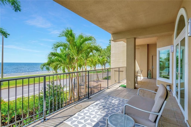 balcony featuring a water view