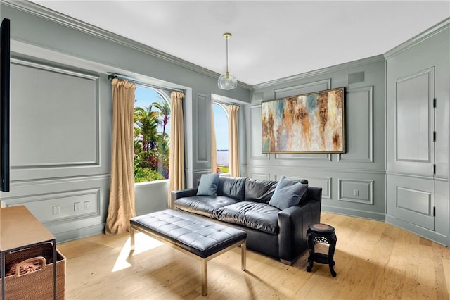 interior space with ornamental molding and light hardwood / wood-style flooring