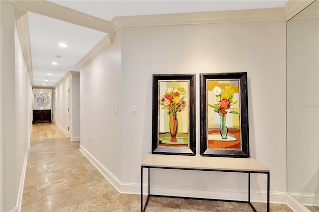 hallway with light tile floors and ornamental molding