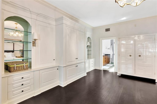 interior space with crown molding, dark hardwood / wood-style flooring, and a notable chandelier