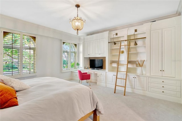 bedroom with light colored carpet, built in desk, ornamental molding, and an inviting chandelier