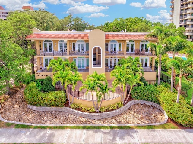 mediterranean / spanish-style house with a balcony