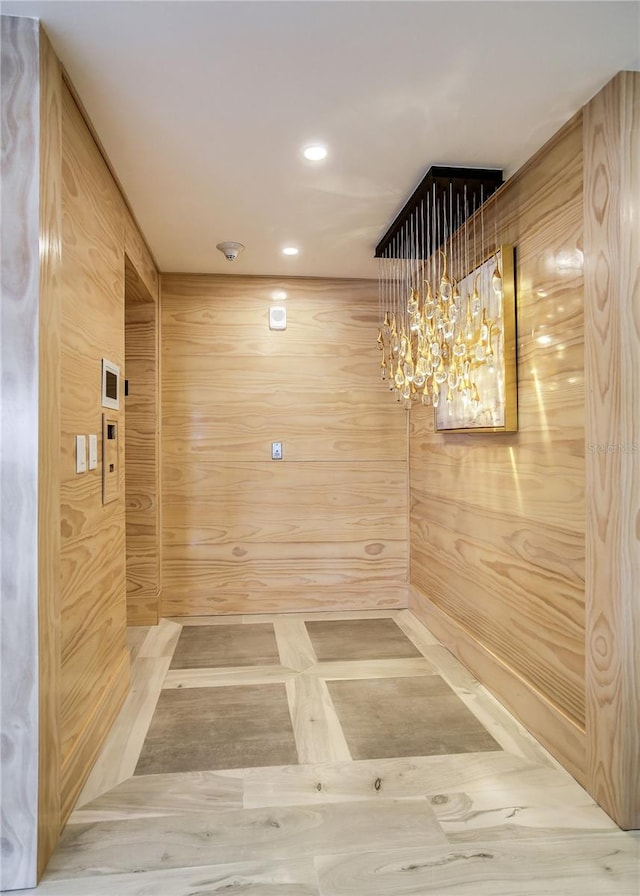 interior space featuring wood walls