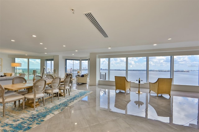 dining room featuring a water view