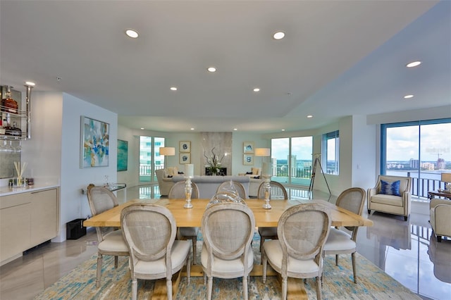 tiled dining area featuring plenty of natural light