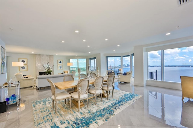 dining room featuring a water view