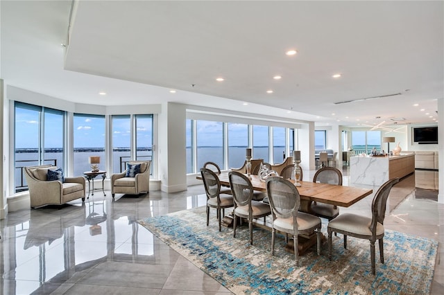 dining space featuring a water view